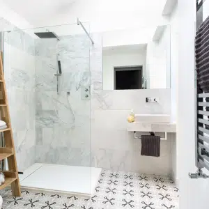 White modern bathroom with glass shower cubicle